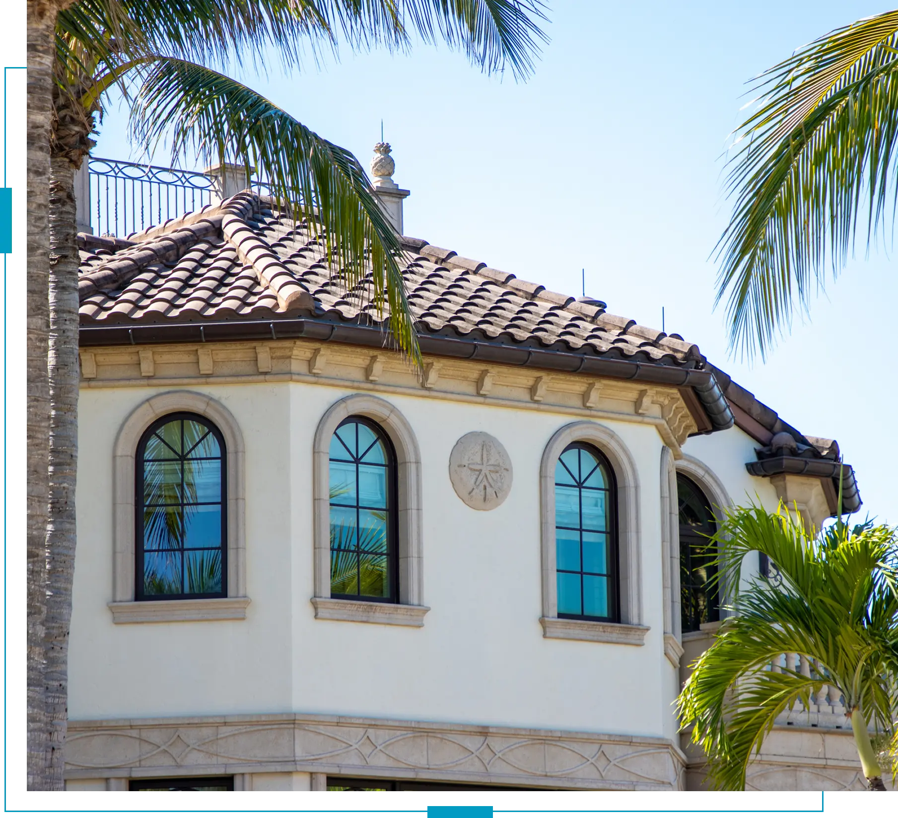 Mediterranean-style house with palm trees.